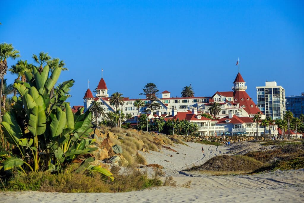 In the distance, on a clear day, the red and white Hotel Del stands strong against the San Diego backdrop