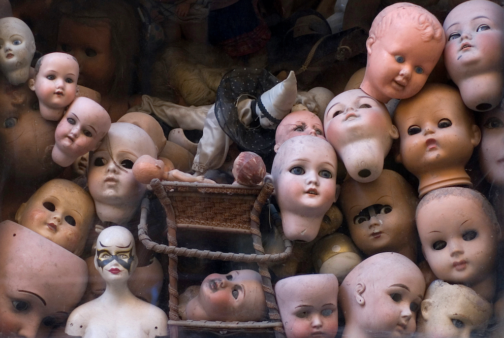 macabre display of old dolls heads