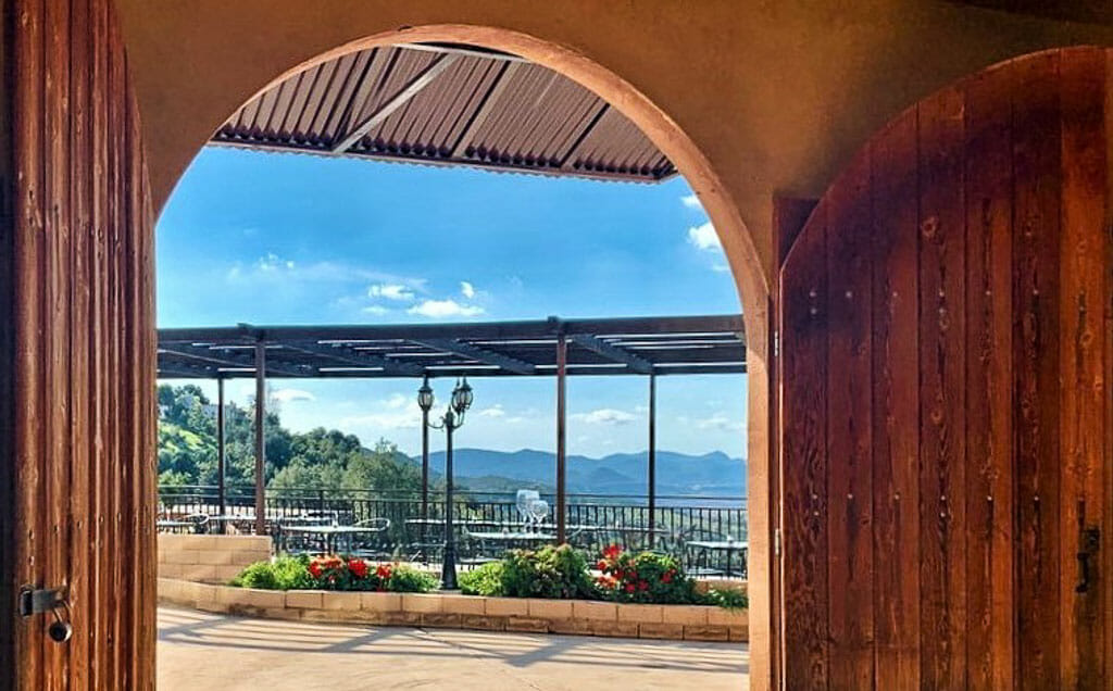 View from inside out to the patio and sweeping views of Cordiano Winery San Diego