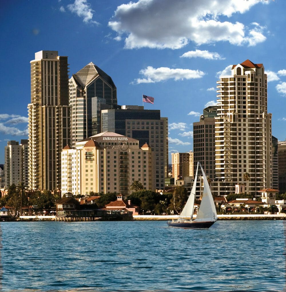 View of San Diego Skyline and Embassy Suites San Diego across the San Diego Bay with Sailboat going by