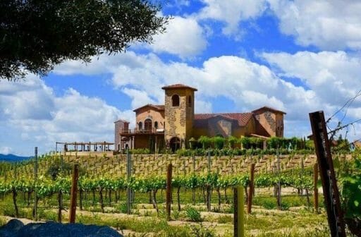 Tuscan architecture inspired house on a hill surrounded by vineyards - Robert Renzoni Vineyards - Best Wineries in Temecula