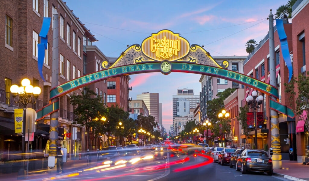 Decorative and lid up street sign over 5th avenue in the Gaslamp Quarter San Diego