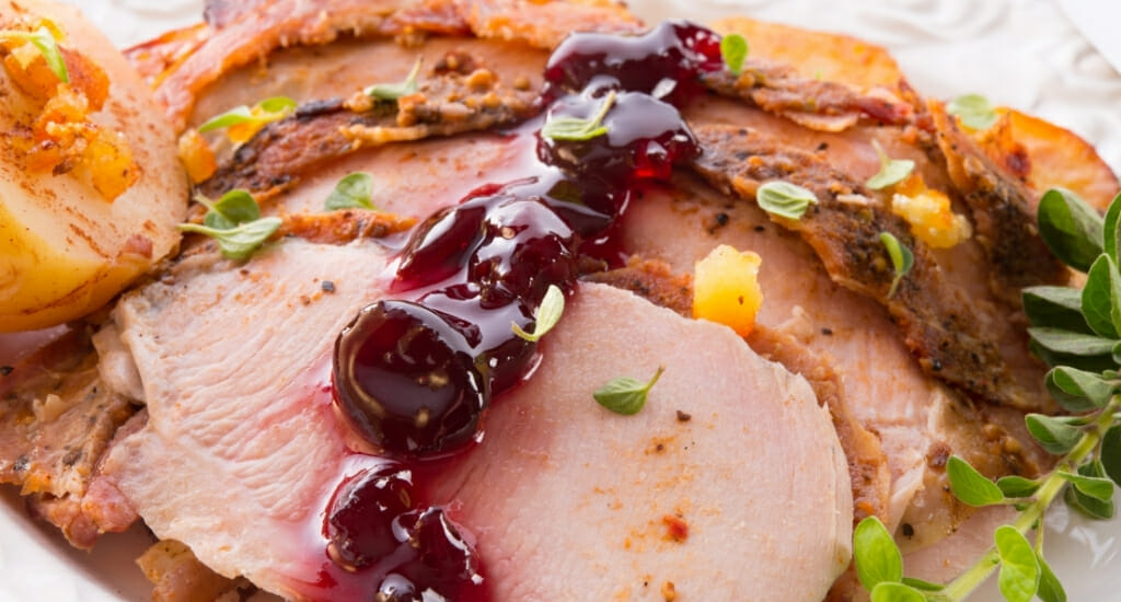 Closeup of turkey breast meat with cranberry relish 