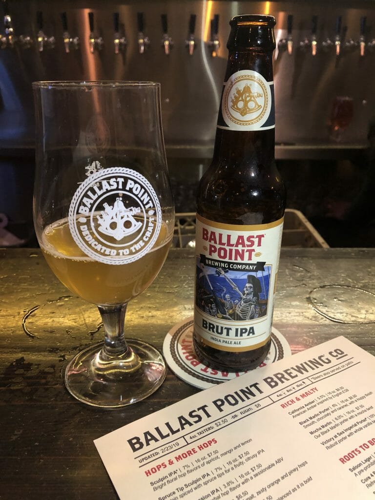Beer glass, beer bottle and menu at Ballast Point Brewery San Diego