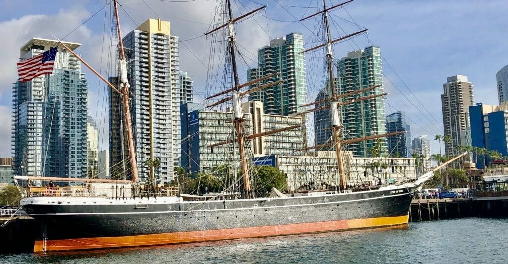 Historic Sailboat Star of India with highrises of San Diego Downtown in the Background