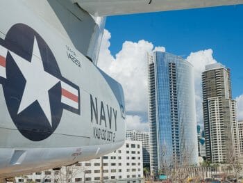 Historic Navy Aircraft on the USS Midway Aircraft carrier with the San Diego skyline in the background - San Diego Military bases
