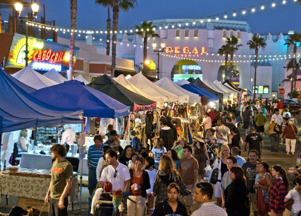 Sunset Market with food stalls and people strolling through market at dusk Photo Credit Visit Oceanside