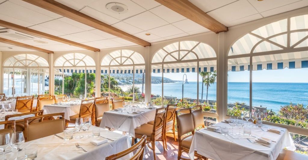 Upscale dining room at Las Brisas restaurant in Laguna Beach with ocean view