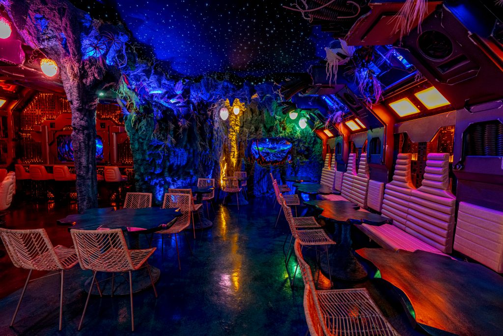 tables in a spaceship themed speakeasy in San Diego
