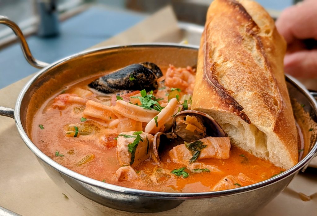 tomatoey fisherman's stew with baguette