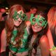 two young women at a party with green St Patricks Day Accessories