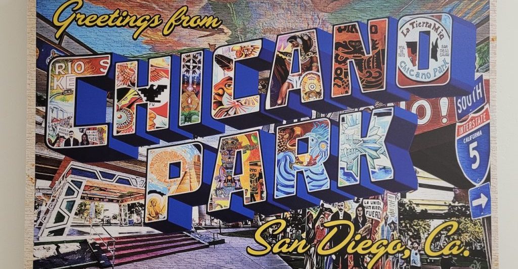 Wall mural painted like a postcard reading "Greetings from Chicano Park San Diego, Co. A National Historic Landmark". Chicano Park murals, Barrio Logan.