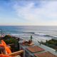 Back patio with outdoor seating overlooking sweeping views of the Pacific Ocean. Luxury Laguna Beach vacation rentals.