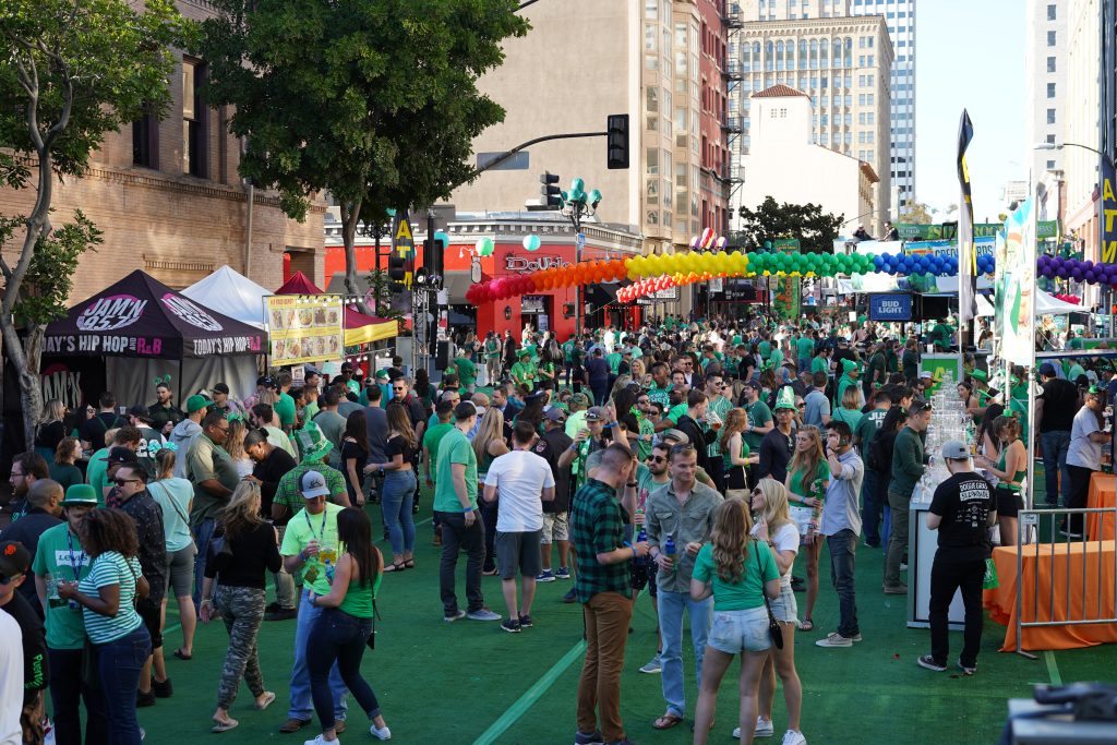 People partying on the street at Gaslamp Quarter Shamrock Party for San Diego St Patrick's Day