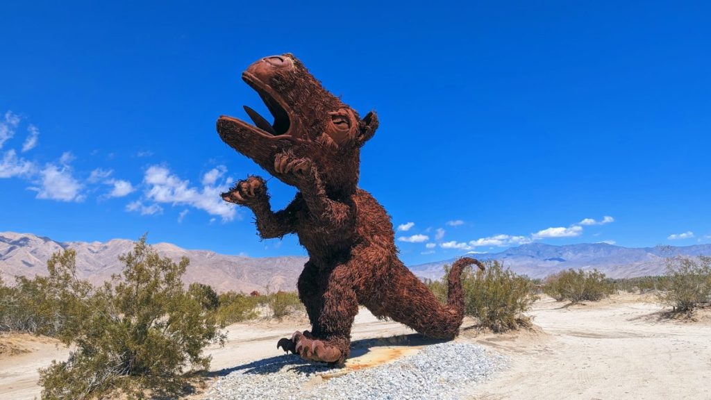 huge rusty metal dinosaur sculpture at Galleta Meadows Estate Borrego Springs - San Diego Day Trips