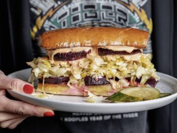 plate with vegan reuben sandwich