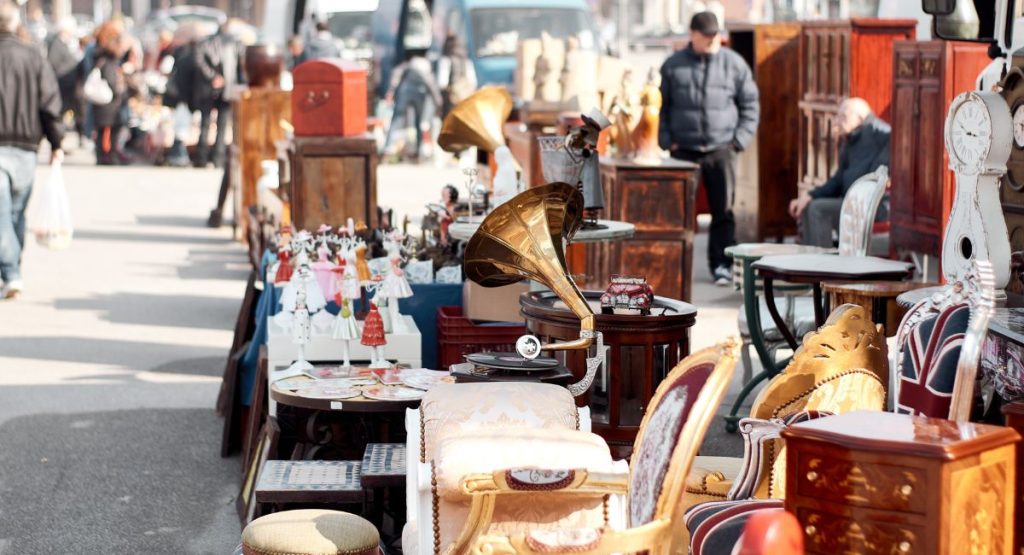 Antiques, home goods, and furniture at outdoor flea market. Vintage Market San Diego Swap Meet.