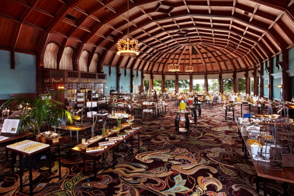 Large restaurant/ballroom space with vaulted wood ceilings and large buffet area at luxury hotel resort. Hotel del Coronado, The Crown Room, Easter Brunch in San Diego.