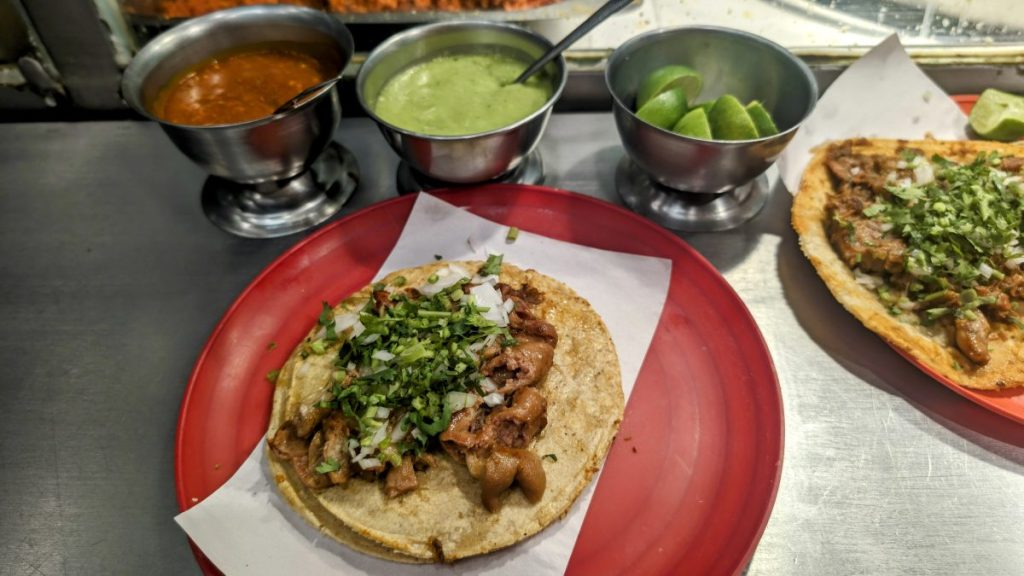 Selection of tacos and salsas at a taco shop in Mexico City